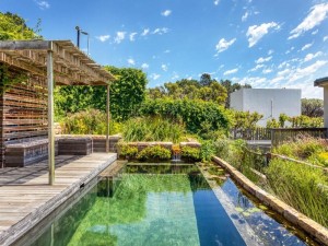  Vacation Hub International | Solar-Powered Mountain Retreat with Natural Pool Main